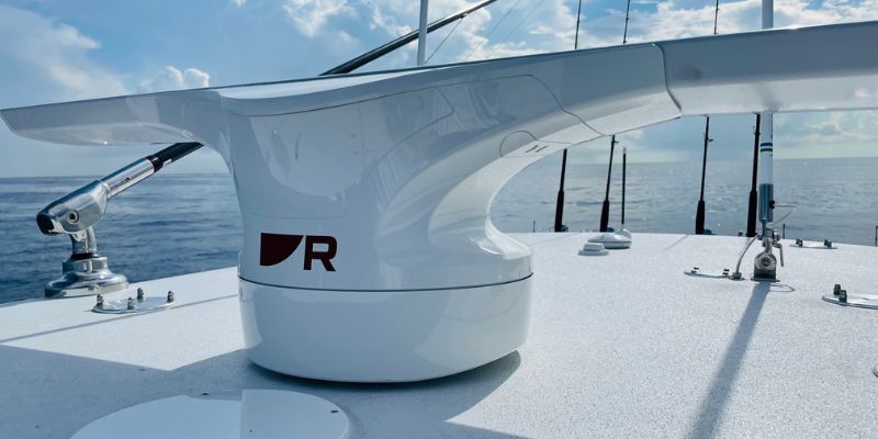 Close-up view of the Raymarine Cyclone Radar mounted on a boat, showcasing its sleek, aerodynamic design and compact profile, perfect for modern marine navigation